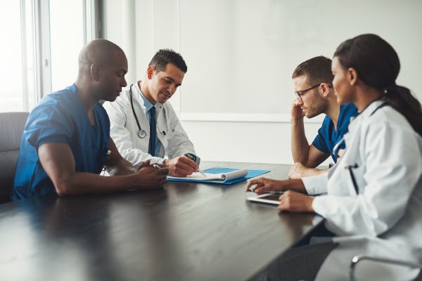 group of physicians reviewing information
